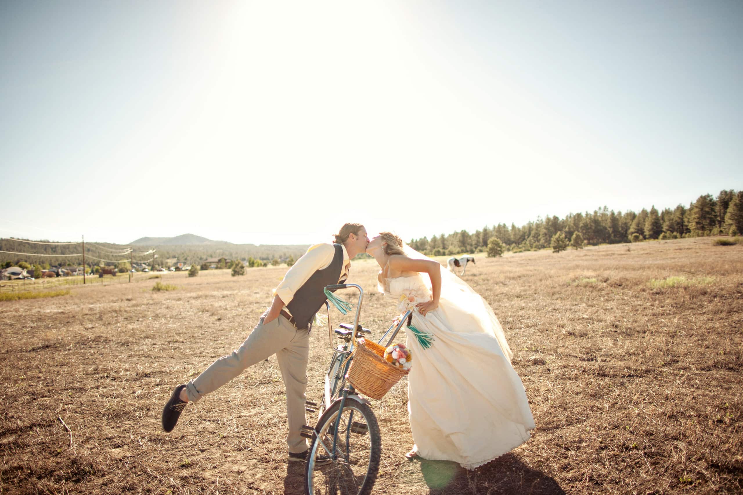 Flagstaff field wedding couple with bicycle